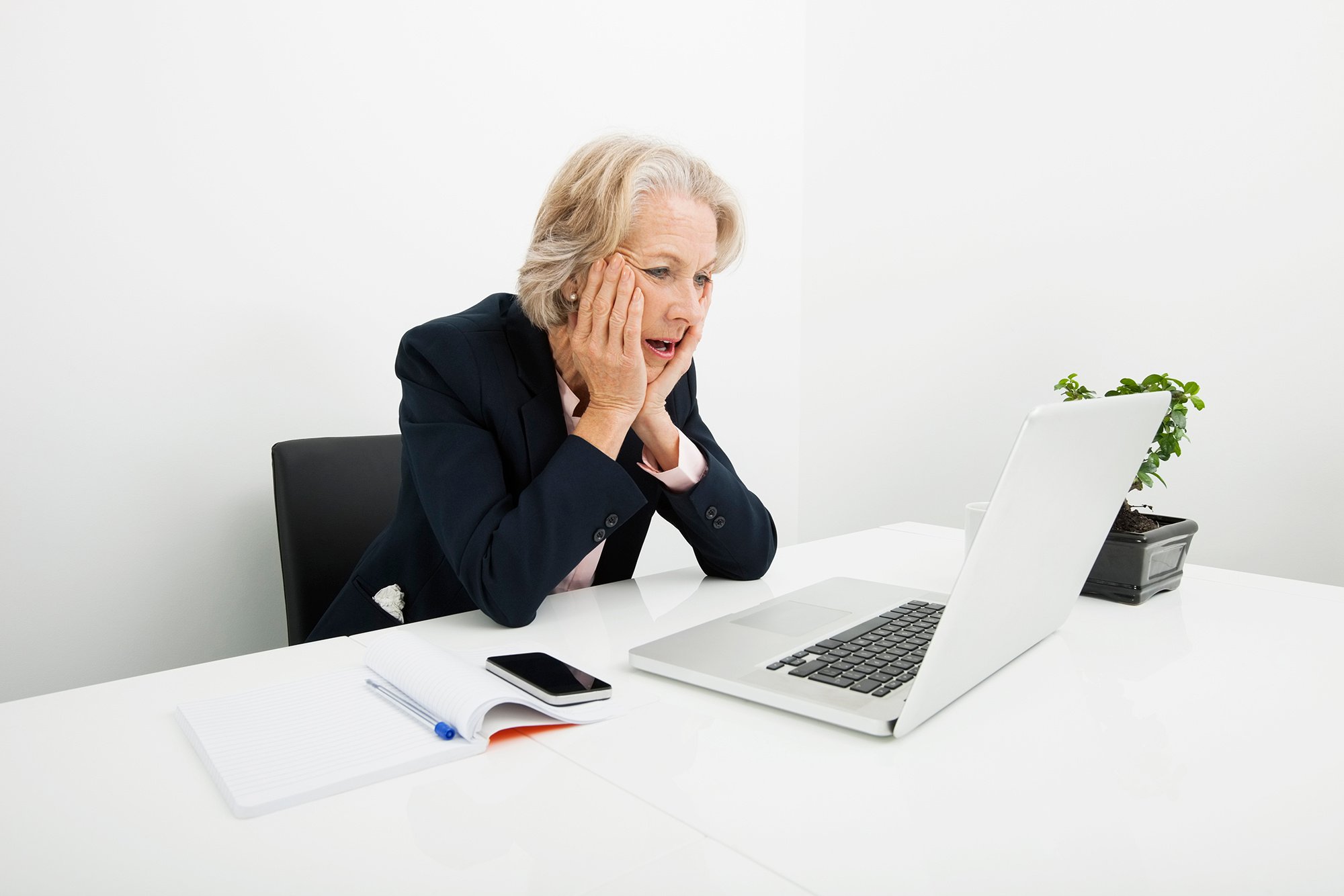 Woman lawyer looking at computer with exasperated expression